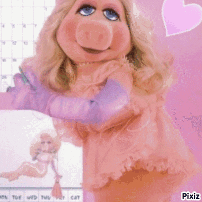 a picture of miss piggy with a calendar in the background