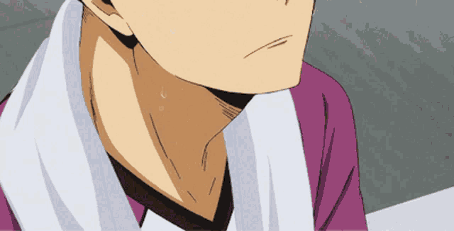 a close up of a man 's neck with a towel around his neck