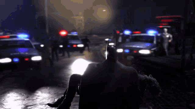a blurred image of a batman carrying a person in a wheelchair