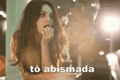 a woman with her mouth open and the word to abismada written on the bottom