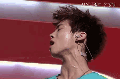 a close up of a man 's neck with a foreign language written in the corner