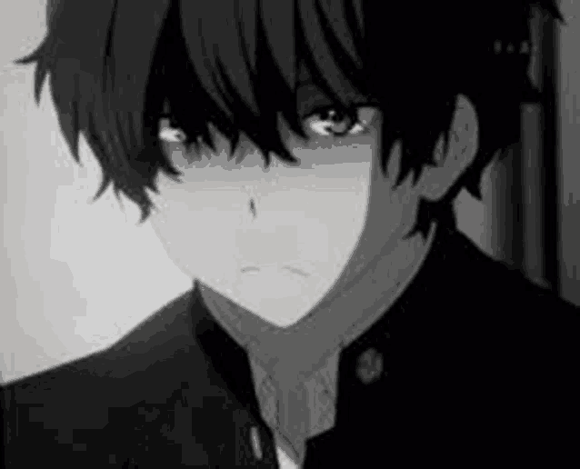 a black and white photo of a boy in a suit crying .