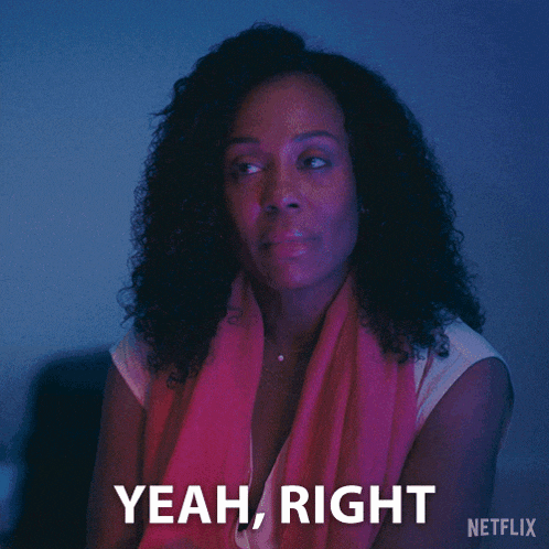 a woman with curly hair says yeah right
