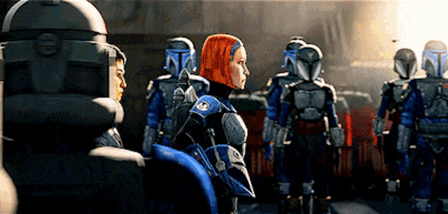 a group of soldiers are standing in a line and one of them is wearing a helmet .