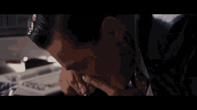 a close up of a person 's hand holding a pencil