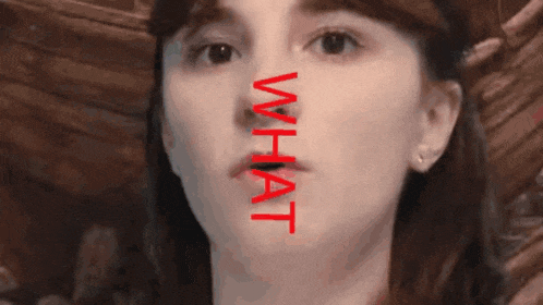 a close up of a woman 's face with the word what written on it