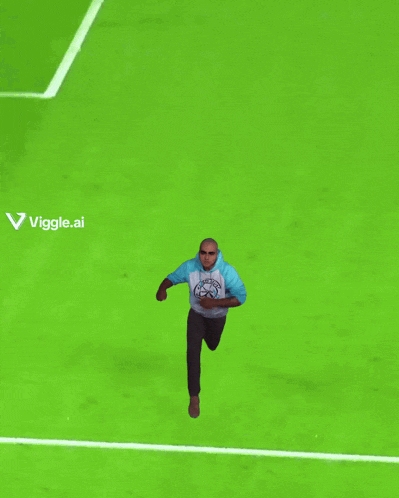 a man is kneeling on a soccer field with a pepsi ad behind him