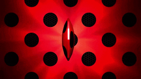 a red ball with black dots on it is surrounded by black polka dots .