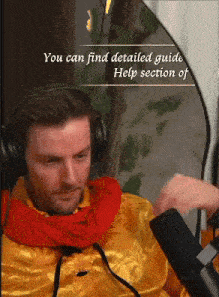 a man wearing headphones is sitting in front of a microphone with the words you can find detailed guide help section of