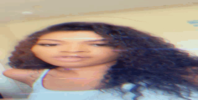 a close up of a woman 's face with a blurred background