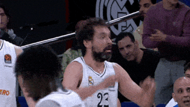 a man with a beard wearing a number 23 jersey