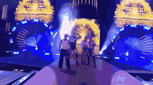 a group of people are standing on a stage and one of them is wearing a shirt that says u.s.d.d.