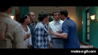a group of people are standing in a room with a sign that says ' sneha ' on it