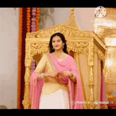 a woman in a pink and white dress is standing in front of a gold throne ..