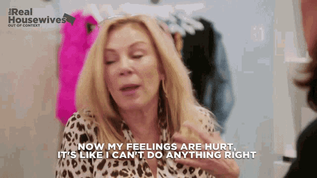 a woman in a leopard print shirt is talking about her feelings