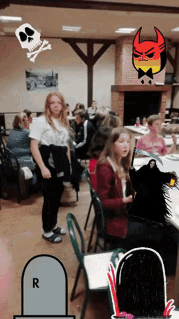 a group of people are gathered in a room with a skull and crossbones and a devil