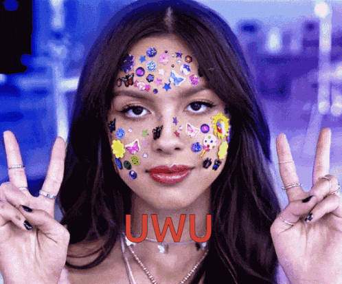 a woman with stickers on her face and the word uwu on the bottom right