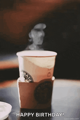 a cup of coffee with steam coming out of it and the words happy birthday written below it