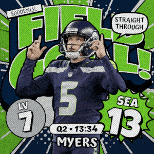 a seahawks football player giving a high five