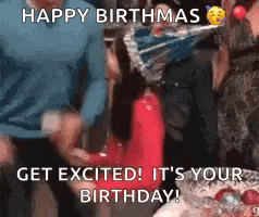 a group of people are celebrating a birthday with balloons and a birthday cake .