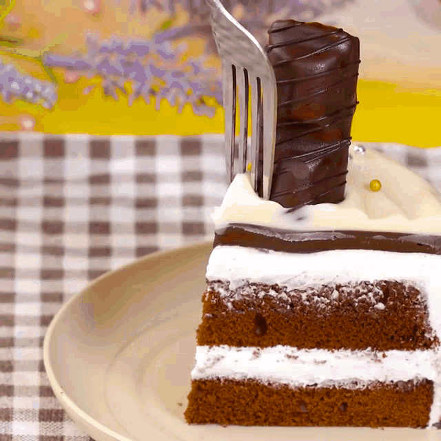 a piece of cake with a fork sticking out of it on a plate