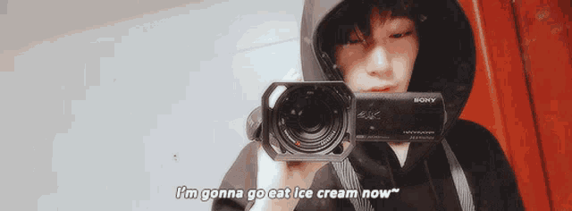a person is holding a sony camera and saying i 'm gonna go eat ice cream now