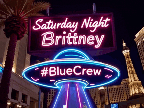 a neon sign for saturday night brittney with a blue ufo in the background