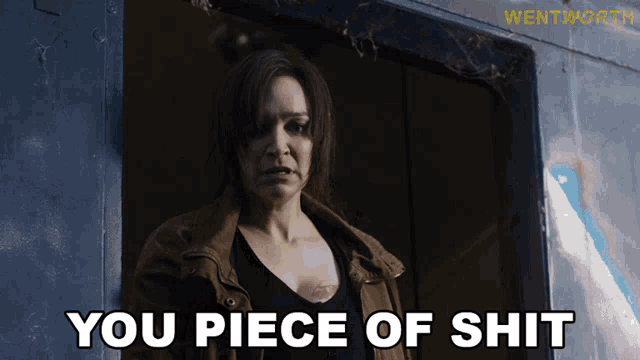 a woman says you piece of shit in front of a doorway
