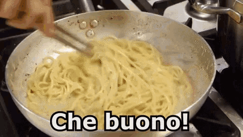 a person is stirring noodles in a pan with the words che buono written on the bottom