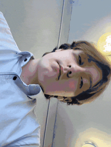 a close up of a person 's face with a light behind them