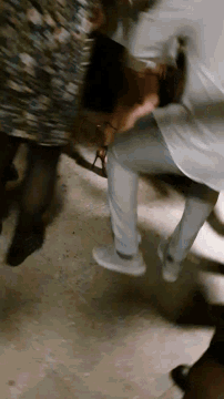 a person is laying on the ground with their head on the ground .