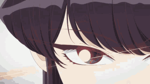 a close up of a girl 's eye with a yellow glow