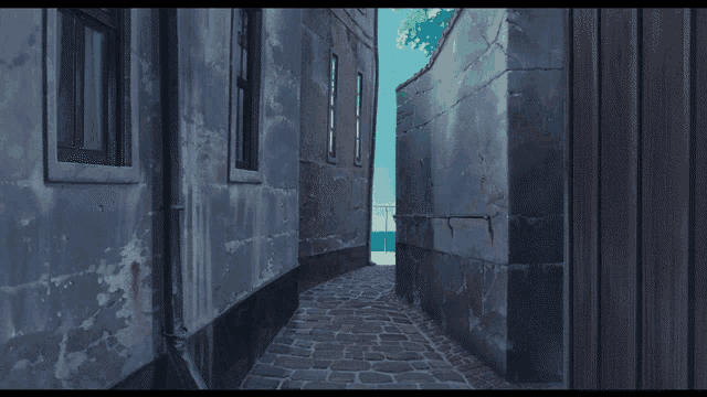 a narrow alleyway between two buildings with a wooden gate