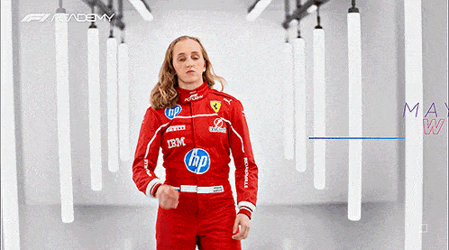 a woman wearing a red racing suit with hp and ibm logos on it