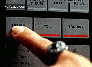 a person is pressing a button that says toil