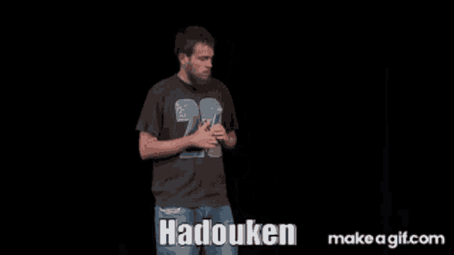 a man with a beard is wearing a shirt that says hadouken