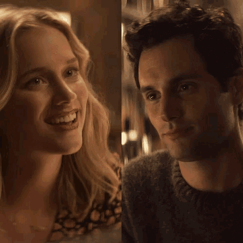 a man and a woman are smiling and looking into each other 's eyes