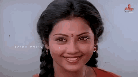 a close up of a woman 's face with the words saina music written on the bottom