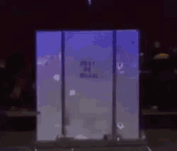 a man is standing in front of a box that says post all mail on it