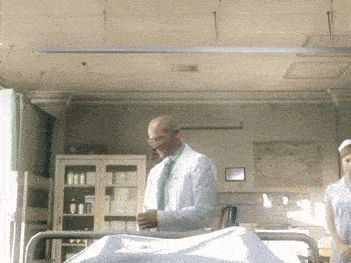 a doctor and nurse in a hospital room