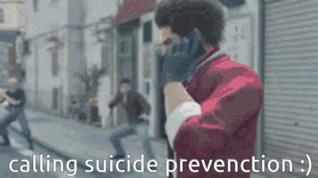 a man talking on a cell phone with the words calling suicide prevention written below him