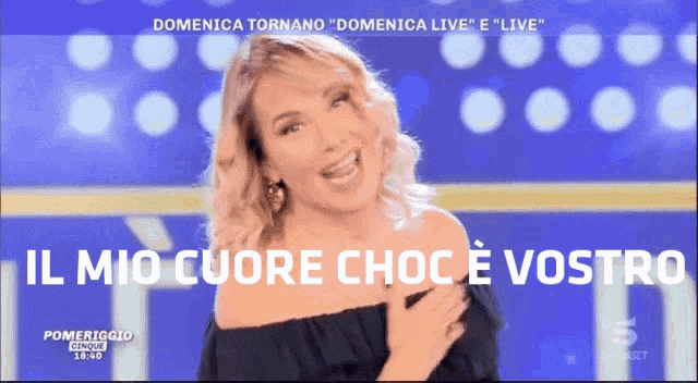 a woman on a television screen with the words " il mio cuore choc e vostro " on the bottom