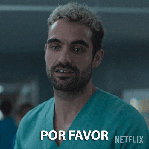 a man wearing a scrub top with the words por favor written on it