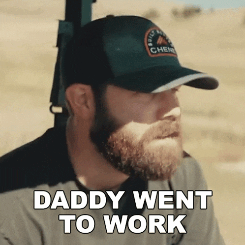 a man with a beard wearing a hat that says " daddy went to work "