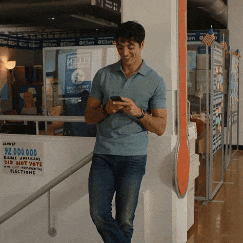a man leans against a wall with a sign that says 92000000