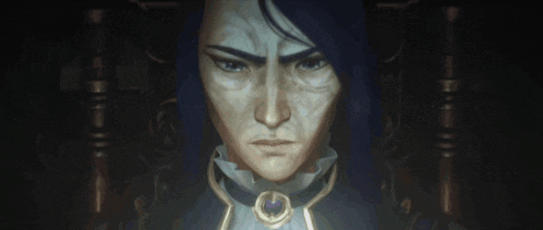 a close up of a person 's face with a necklace around their neck .