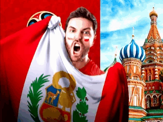 a man is holding a peruvian flag in front of a russian cathedral
