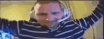 a pixelated image of a man wearing headphones and a striped sweater