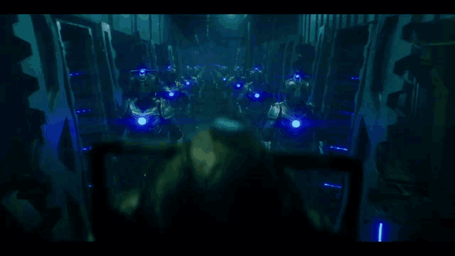 a group of robots with blue lights on their heads