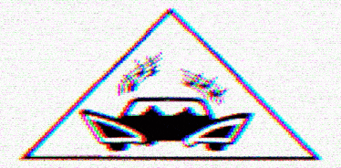 a triangle with a car inside of it and a few birds on it
